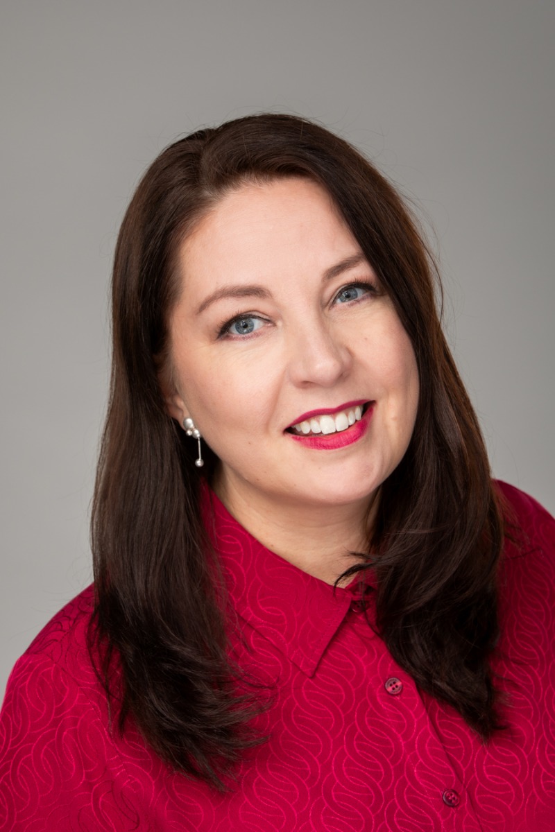 Headshot of Consul General Miia Rantanen wearing a red shirt