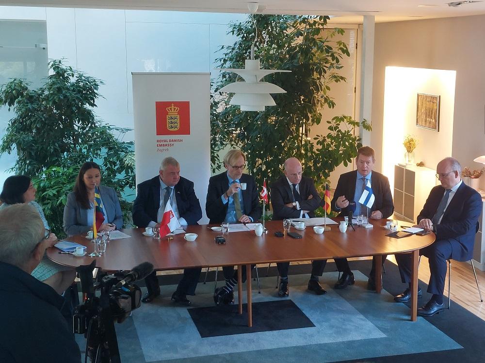 Nordic, Baltic, German and Polish Ambassadors sitting around a table.