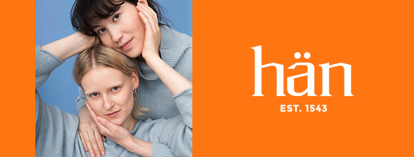 Hän logo on an orange background and photo of two people hugging