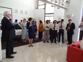 Embassy staff raising a toast to the new ambassador