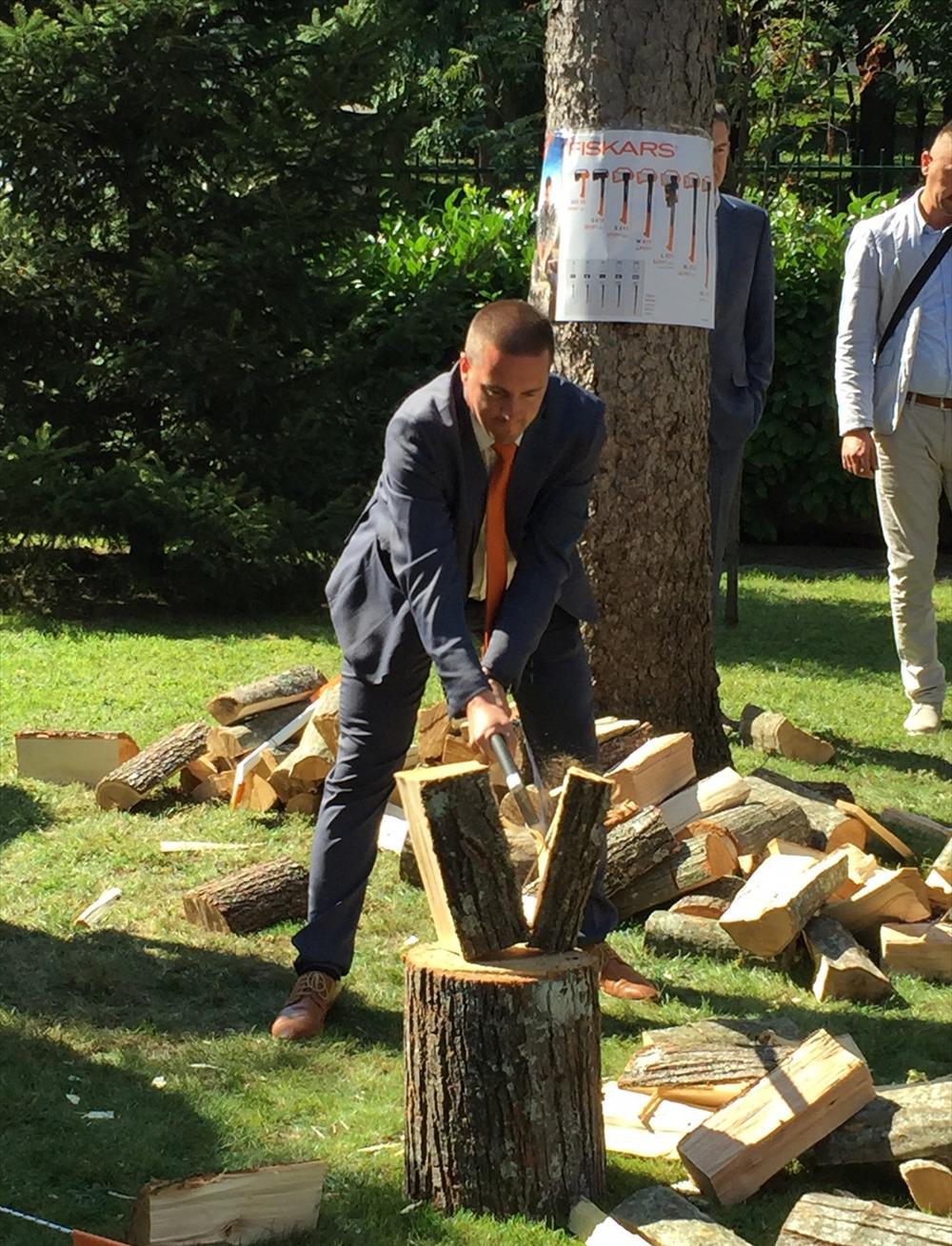 Embassy's Economic Advisor Igor Madzarevic testing the sharpness of Fiskars axes.